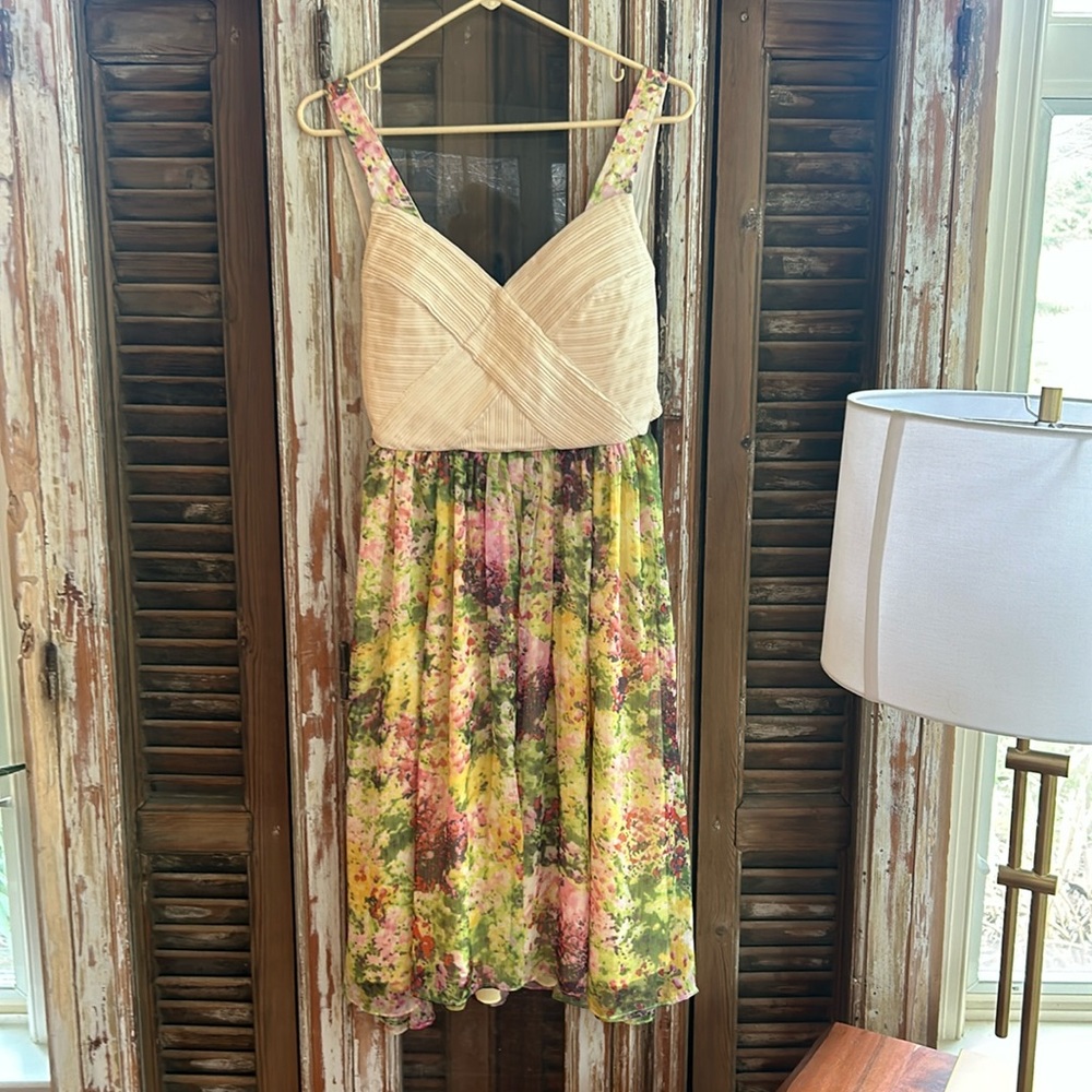 McCann. Size 4. Used. No damage. Great shape and unique back. Built in bra
